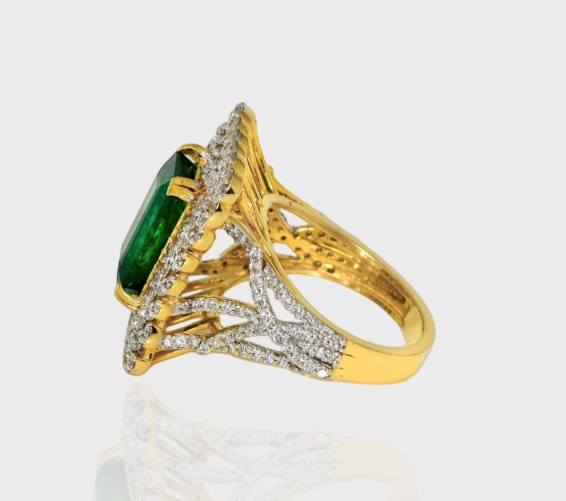 Emerald Octagon and Diamond Round Ring, Crafted to perfection, this exquisite piece harmonizes the allure of a striking octagonal emerald with the brilliance of surrounding diamond rounds.(PGDR0370)