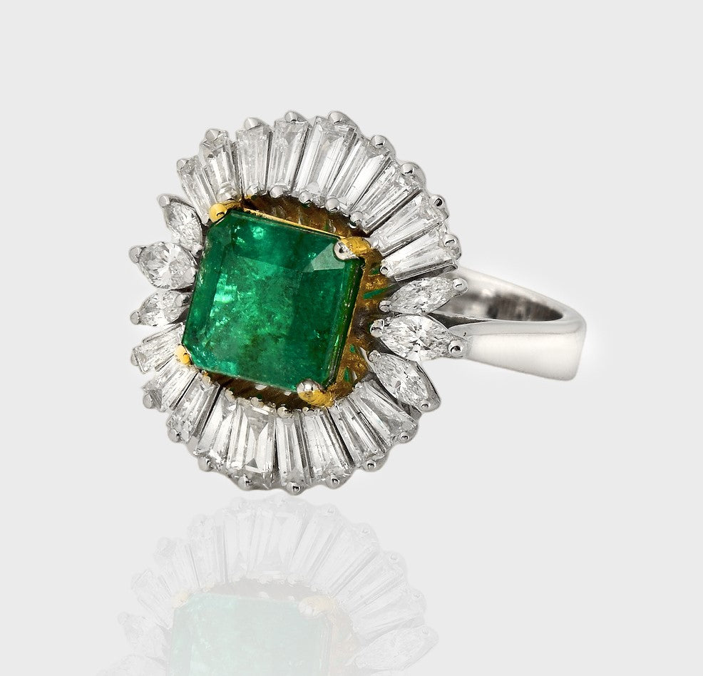 Introducing our striking Emerald Octagon Ring, adorned with a mesmerizing combination of diamond baguettes and marquise-cut diamonds, creating a truly breathtaking piece that radiates sophistication and glamour.(PGDR0417)