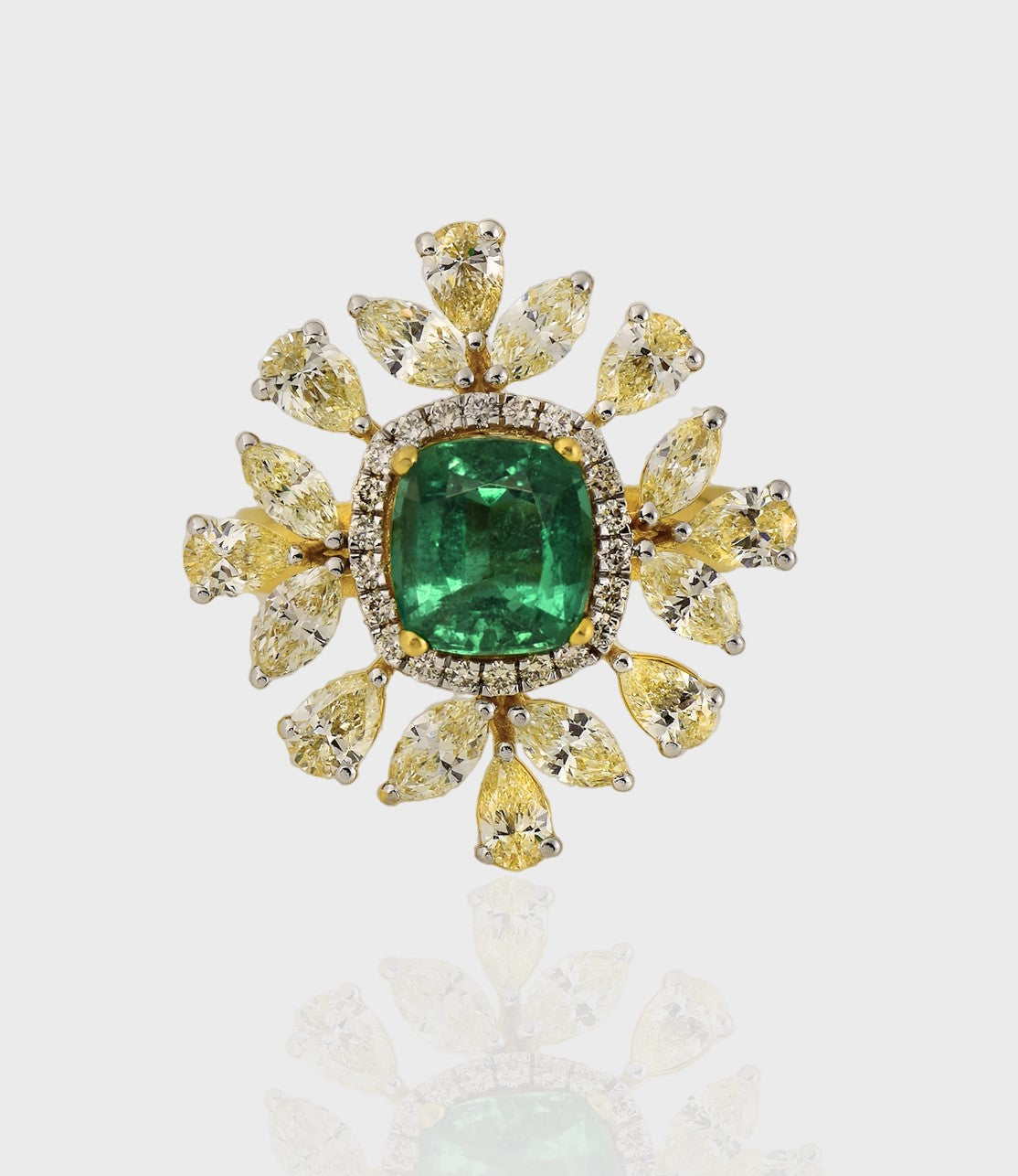 Introducing our exquisite Ring, a masterpiece of unparalleled beauty and sophistication, adorned with a fine quality Emerald and an array of multi-shaped Diamonds.(PGDR0434)