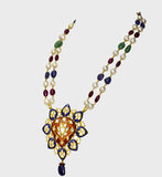 Red and blue Meena big pendant, adorned with dazzling diamond polki, strung alongside the rich hues of emerald, ruby, sapphire, and the lustrous elegance of South Sea pearls.(KMNE3406)