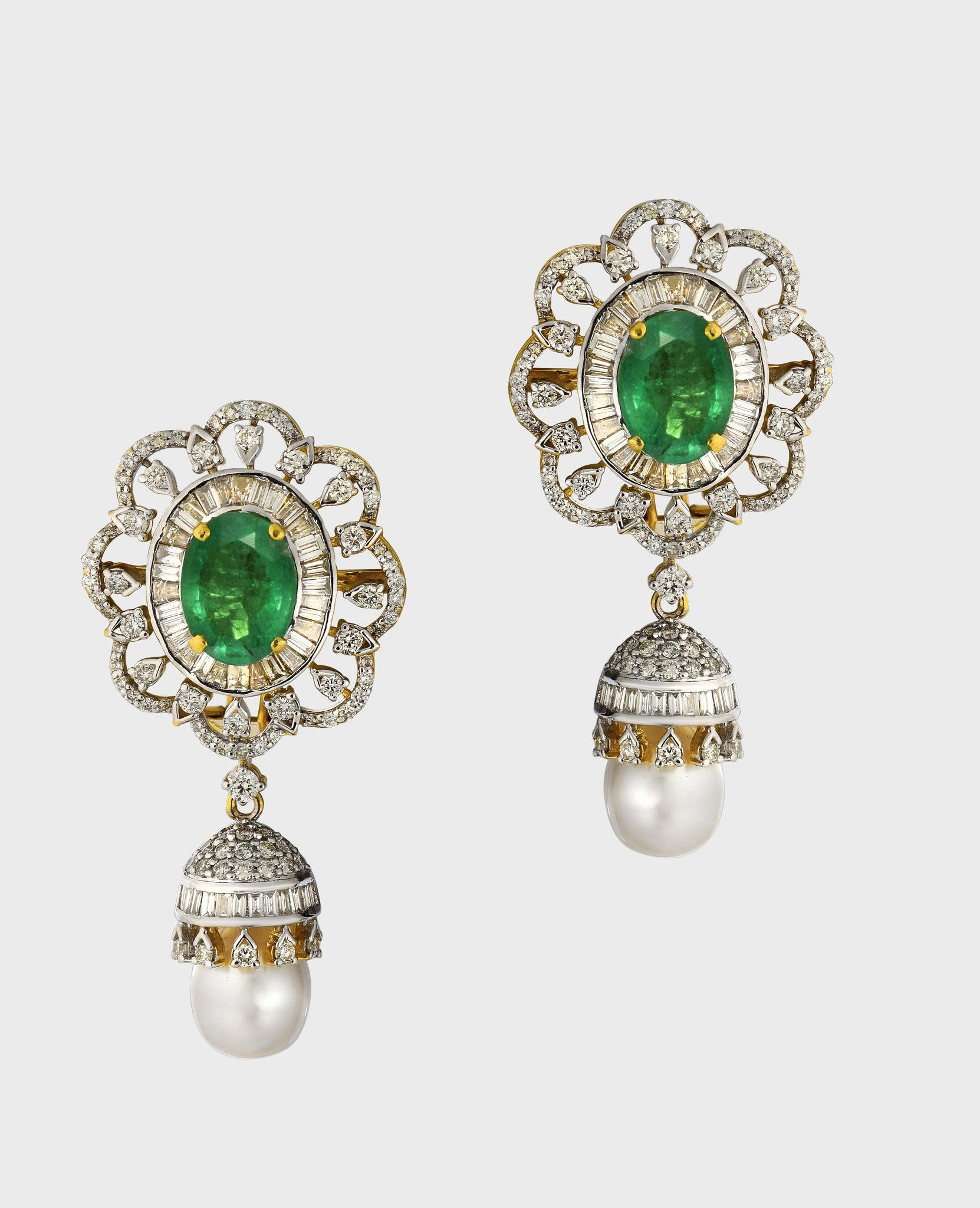 Embrace sophistication and grace with our enchanting earring pair. Featuring mesmerizing emerald-cut ovals adorned with sparkling diamonds, elegantly crowned with South Sea pearl drops accented by diamond caps.(PGDE0381)