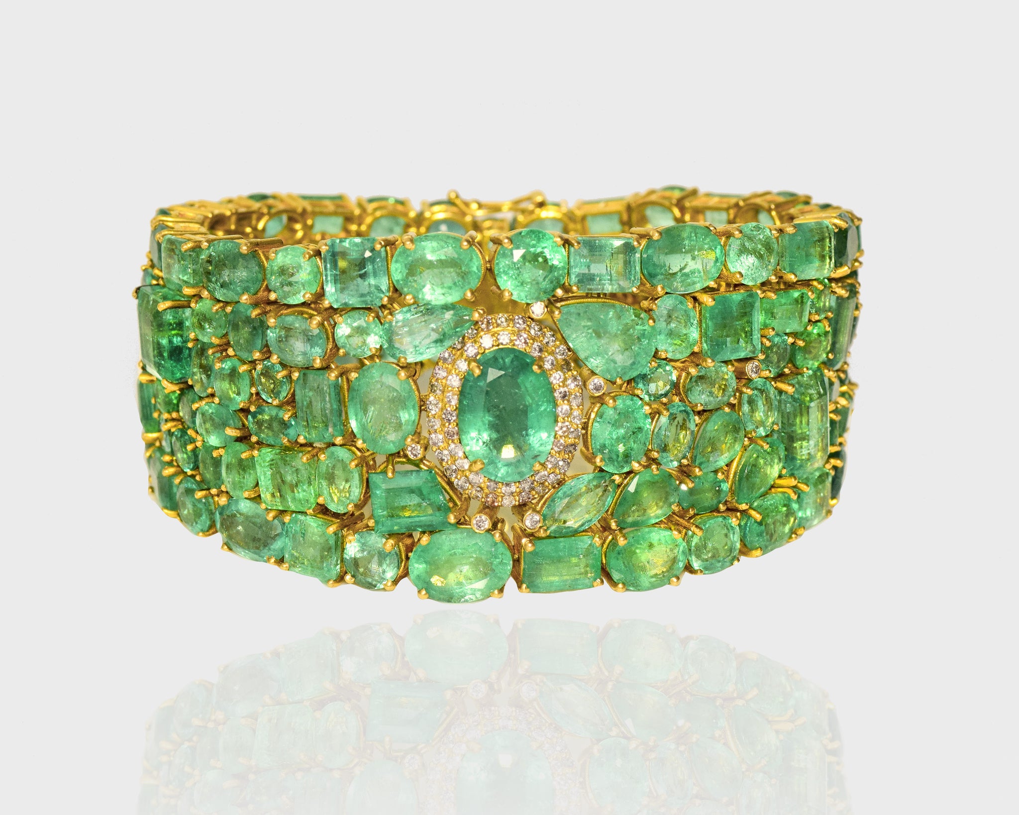 Elevate your wrist with our enchanting bracelet, adorned with a captivating assortment of multi-shaped emeralds and diamonds. A timeless fusion of sophistication and allure, perfect for adding a touch of elegance to any ensemble.(AJBR)