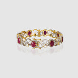Grace meets heritage in this elegant bangle, crafted with sparkling Diamond Polki, brilliant round diamonds, and vibrant rubies. (GDB0256)