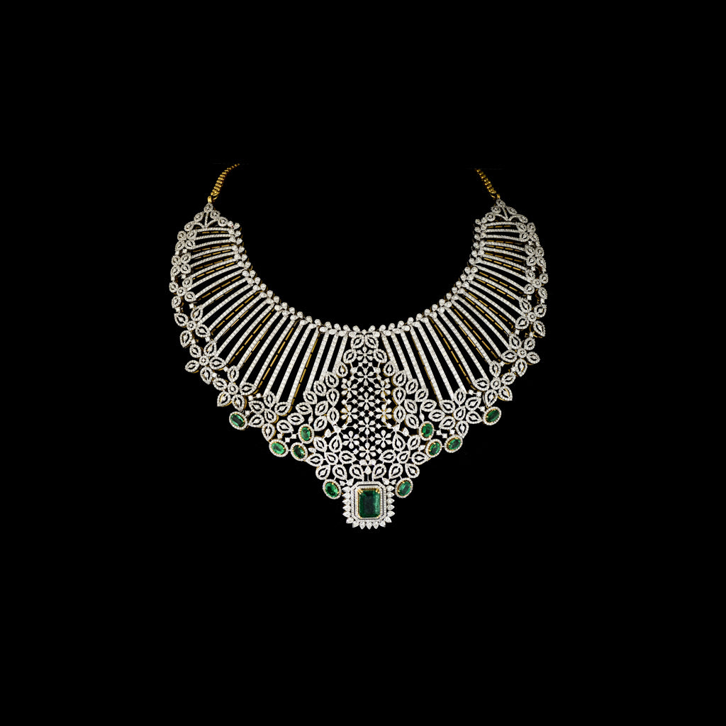 Exude timeless elegance with this stunning diamond and emerald necklace and earring set. A bold designer masterpiece, perfect for grand occasions.(GDNE0510)