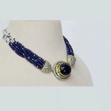 A regal choker-style necklace featuring an oval sapphire cabochon with diamonds, strung with sapphire beads and luminous pearls for a refined, timeless statement. (GDNE0518)
