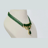 A striking necklace showcasing an octagon emerald centre framed by round diamonds, strung with emerald beads for rich colour, refined elegance, and timeless luxury. (GDNE0528)