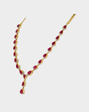 An elegant single-line necklace adorned with round diamonds and ruby cabochon drops, creating graceful movement, rich colour, and timeless sophistication. (GDNE0532)