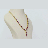 An elegant single-line necklace adorned with round diamonds and ruby cabochon drops, creating graceful movement, rich colour, and timeless sophistication. (GDNE0532)