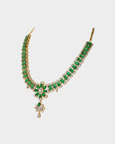 An exquisite necklace and earring set featuring oval emeralds with mutual-cut diamond centres, accented by round diamonds for timeless elegance, luxurious brilliance, and sophisticated charm. (GDNE0535)