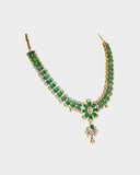 An exquisite necklace and earring set featuring oval emeralds with mutual-cut diamond centres, accented by round diamonds for timeless elegance, luxurious brilliance, and sophisticated charm. (GDNE0535)