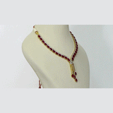 Ruby Cascade Diamond Necklace Set Brilliant oval rubies paired with sparkling diamonds create a graceful necklace set, complemented by elegant drop earrings for timeless sophistication and refined luxury.(GDNE0541)