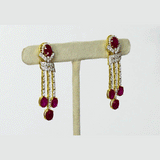 Ruby Cascade Diamond Necklace Set Brilliant oval rubies paired with sparkling diamonds create a graceful necklace set, complemented by elegant drop earrings for timeless sophistication and refined luxury.(GDNE0541)