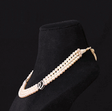A classic three-string pearl necklace adorned with dazzling round diamonds, designed for graceful elegance and everlasting beauty.(GDNE0545)
