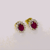 Ruby & Diamond Stud Earrings Classic ruby and diamond stud earrings showcasing vivid rubies surrounded by brilliant diamonds, perfect for adding timeless luxury to every look.(GDNE0547)