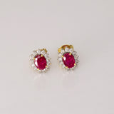 Ruby & Diamond Stud Earrings Classic ruby and diamond stud earrings showcasing vivid rubies surrounded by brilliant diamonds, perfect for adding timeless luxury to every look.(GDNE0547)