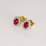 Ruby & Diamond Stud Earrings Classic ruby and diamond stud earrings showcasing vivid rubies surrounded by brilliant diamonds, perfect for adding timeless luxury to every look.(GDNE0547)