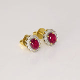 Ruby & Diamond Stud Earrings Classic ruby and diamond stud earrings showcasing vivid rubies surrounded by brilliant diamonds, perfect for adding timeless luxury to every look.(GDNE0547)