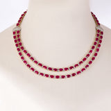 Ruby Radiance Double-Line Necklace Set A captivating double-line necklace showcasing vibrant oval rubies and sparkling diamonds, paired with elegant matching earrings for timeless glamour, sophistication, and luxurious brilliance.(GDNE0548)