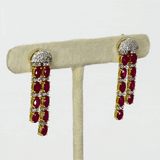 Ruby Radiance Double-Line Necklace Set A captivating double-line necklace showcasing vibrant oval rubies and sparkling diamonds, paired with elegant matching earrings for timeless glamour, sophistication, and luxurious brilliance.(GDNE0548)