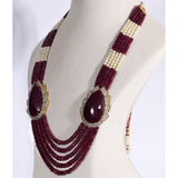 Regal Ruby Beaded Statement Necklace A magnificent statement necklace featuring oversized ruby centrepieces framed with dazzling diamonds, gracefully strung with ruby beads and luminous pearls for unmatched royal elegance.(GDNE0552)