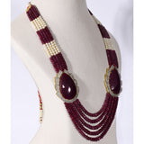 Regal Ruby Beaded Statement Necklace A magnificent statement necklace featuring oversized ruby centrepieces framed with dazzling diamonds, gracefully strung with ruby beads and luminous pearls for unmatched royal elegance.(GDNE0552)