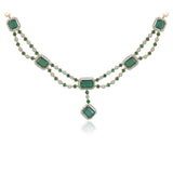 A stunning blend of emerald-cut emeralds and sparkling diamonds, this elegant necklace set is crafted to make every occasion unforgettable.(GDNE0553)