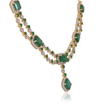 A stunning blend of emerald-cut emeralds and sparkling diamonds, this elegant necklace set is crafted to make every occasion unforgettable.(GDNE0553)