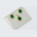 Classic pendant and earring set with oval emeralds and round diamonds, offering graceful elegance and timeless appeal. (GDPE0415 & GDE0475)