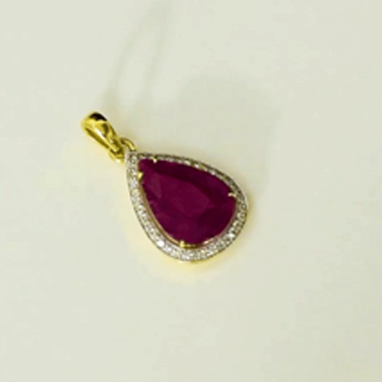 Ruby & Diamond Pendant A vibrant ruby pendant framed with brilliant diamonds, designed to add effortless elegance and timeless beauty to your jewellery collection.(GDPE0417)