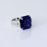 A mesmerizing deep blue sapphire ring adorned with sparkling diamonds, crafted to reflect timeless elegance, luxury, and sophistication for every special occasion.(GDR0350)