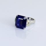 A mesmerizing deep blue sapphire ring adorned with sparkling diamonds, crafted to reflect timeless elegance, luxury, and sophistication for every special occasion.(GDR0350)