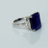 A mesmerizing deep blue sapphire ring adorned with sparkling diamonds, crafted to reflect timeless elegance, luxury, and sophistication for every special occasion.(GDR0350)