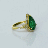 Pear-cut emerald ring with sparkling diamonds, designed for timeless elegance, luxury, and everyday sophistication.(KCA-8)