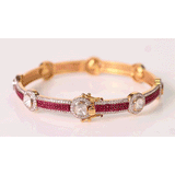 Delicate yet striking, this ruby and diamond bangle adds a touch of brilliance to every occasion.(KMB0628)