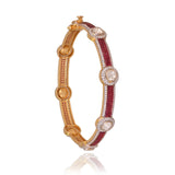 Delicate yet striking, this ruby and diamond bangle adds a touch of brilliance to every occasion.(KMB0628)