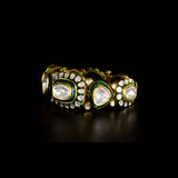 Royal Polki Flexible Bracelet A luxurious flexible bracelet showcasing oversized diamond polki, accented with shimmering polki details and rich green enamel for timeless royal elegance and charm.(KMBR0153)