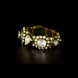 Royal Polki Flexible Bracelet A luxurious flexible bracelet showcasing oversized diamond polki, accented with shimmering polki details and rich green enamel for timeless royal elegance and charm.(KMBR0153)