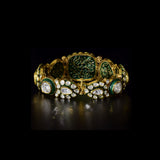 Royal Polki Flexible Bracelet A luxurious flexible bracelet showcasing oversized diamond polki, accented with shimmering polki details and rich green enamel for timeless royal elegance and charm.(KMBR0153)