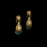 Royal Polki Bridal Necklace Set A magnificent diamond polki necklace featuring ruby detailing, emerald bead hangings, and matching statement earrings—crafted for timeless bridal elegance with regal heritage appeal.(KMNE3643)