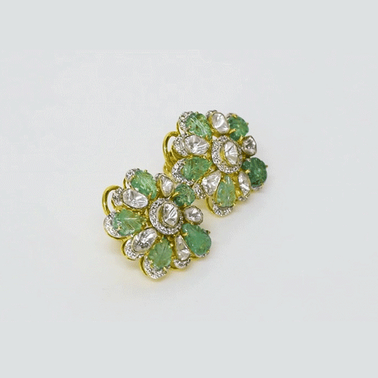 A stunning tops pair featuring diamond polki, round diamonds, and carved emeralds in a fusion design. Blending traditional elegance with contemporary style for a striking statement. (KME2474)