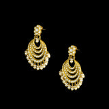 Elegant white chandbali earrings with sparkling Polki diamonds and pearl drops, designed to bring graceful traditional charm and timeless beauty to every occasion.(KME2522)