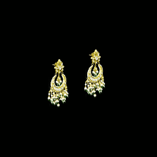 Classic white chandbali earrings adorned with shimmering Polki diamonds and delicate pearl detailing, crafted to add graceful elegance and festive beauty to your traditional look. (KME2523)