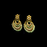 Stunning chandbali earrings adorned with sparkling Polki diamonds, rich red stones, and delicate pearl hangings, beautifully crafted to add royal elegance and festive charm to every celebration.(KME2524)