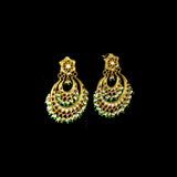 Stunning chandbali earrings adorned with sparkling Polki diamonds, rich red stones, and delicate pearl hangings, beautifully crafted to add royal elegance and festive charm to every celebration.(KME2524)