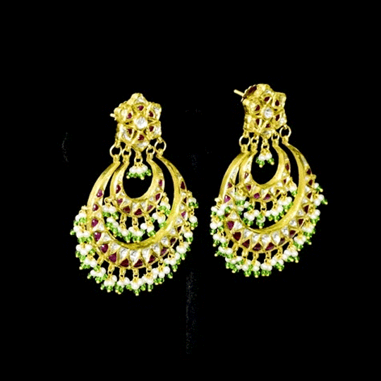 Stunning chandbali earrings adorned with sparkling Polki diamonds, rich red stones, and delicate pearl hangings, beautifully crafted to add royal elegance and festive charm to every celebration.(KME2524)