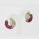 A captivating fusion design showcasing luminous Diamond Polki, sparkling diamonds, and vivid rubies, creating statement earrings perfect for every special occasion.(KME2525)