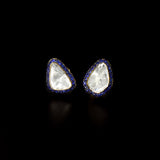 Diamond Polki & Blue Sapphire Tops Elegant Diamond Polki tops surrounded by vibrant blue sapphires, blending timeless heritage, refined craftsmanship, and effortless sophistication for every occasion.(KME2534)