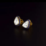 Diamond Polki & Blue Sapphire Tops Elegant Diamond Polki tops surrounded by vibrant blue sapphires, blending timeless heritage, refined craftsmanship, and effortless sophistication for every occasion.(KME2534)