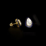 Diamond Polki & Blue Sapphire Tops Elegant Diamond Polki tops surrounded by vibrant blue sapphires, blending timeless heritage, refined craftsmanship, and effortless sophistication for every occasion.(KME2534)