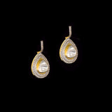 Diamond Polki Drop Earrings Designed to captivate, these drop earrings showcase luminous Diamond Polki framed by brilliant round diamonds, creating a graceful silhouette with modern sophistication and effortless sparkle.(KME2544)